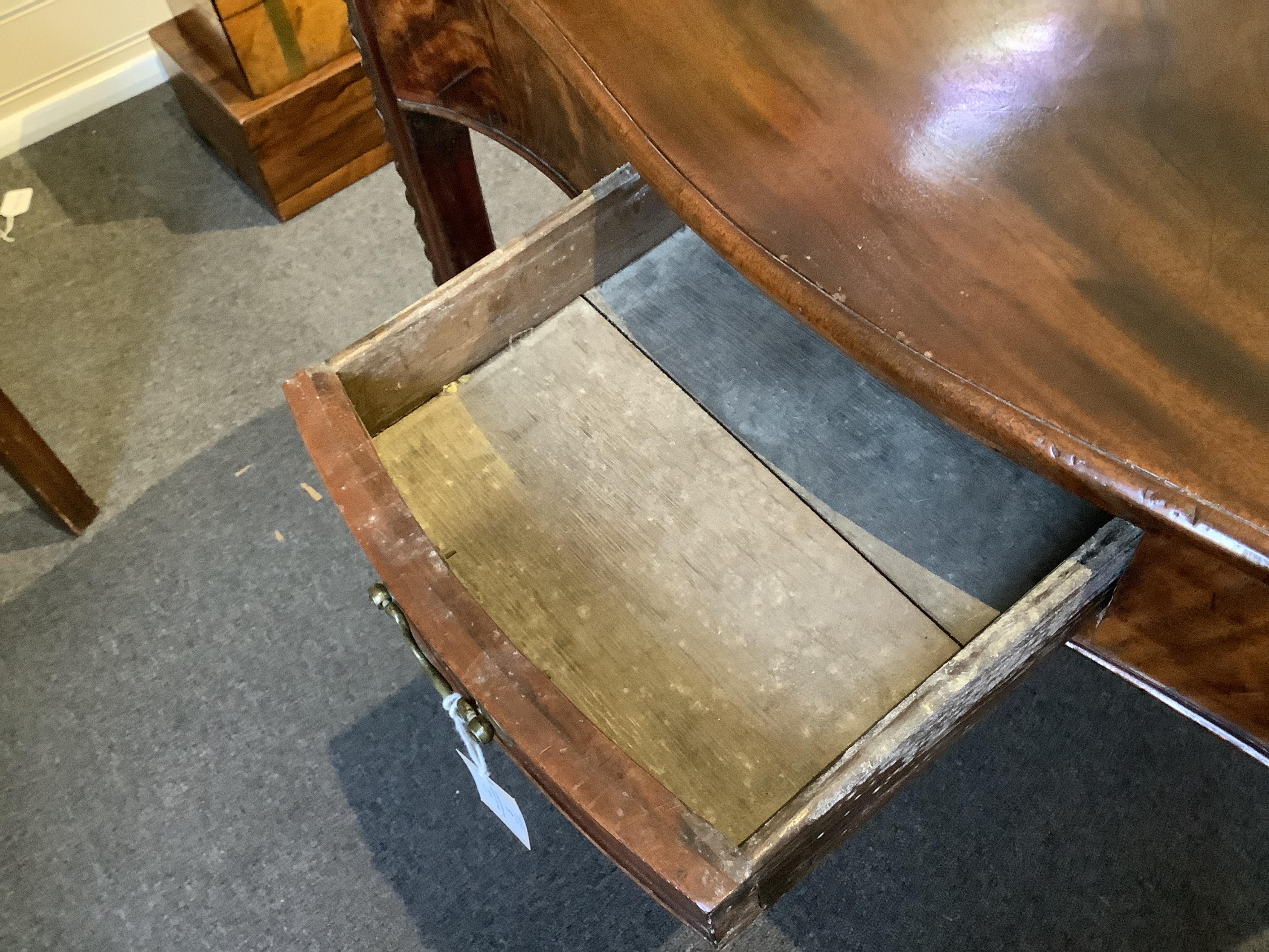 A George III serpentine mahogany tea table